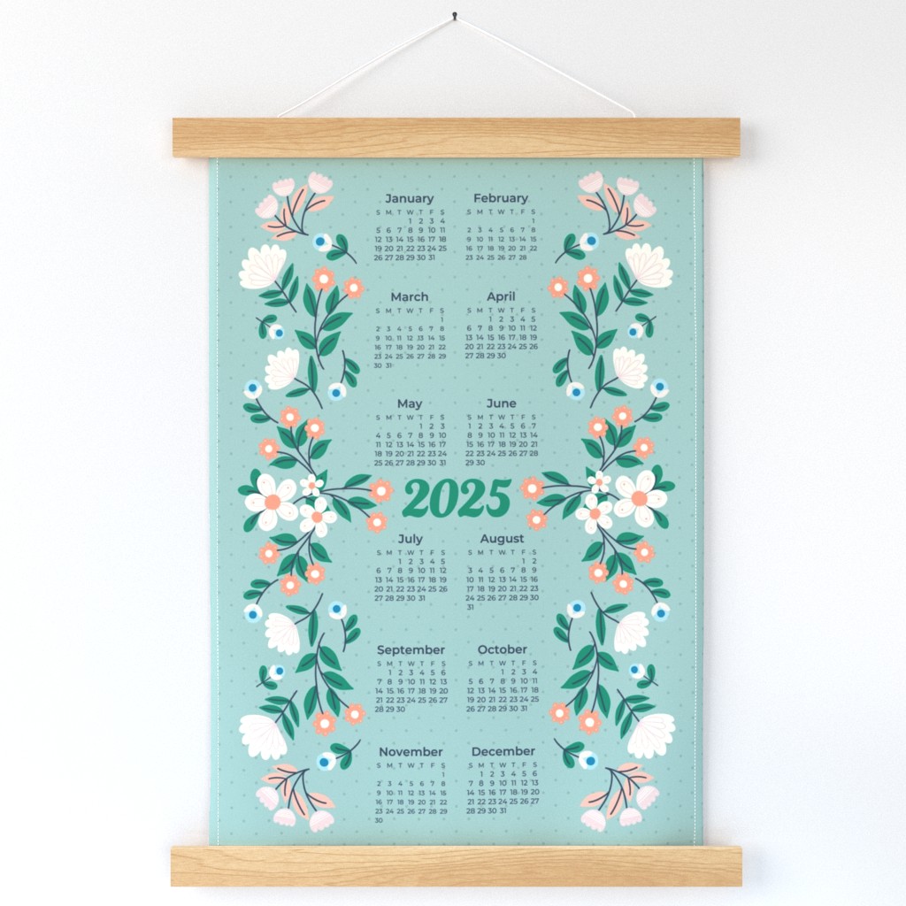 Sincerely Yours Kimberly 2025 Calendar Tea Towel. Mint green and polka dot background. White, peach and pink flowers along the left and right sides. Green leaves with navy blue stems. 2025 in green in the center. The rest of the months and dates surround it in the center of the towel.